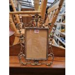 A cast brass easel back frame, 37cm high.