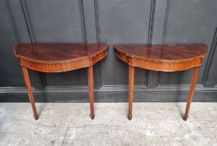 A pair of early 20th century mahogany and inlaid console tables, 80cm wide.