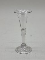 An 18th century gin glass, 12.5cm high.