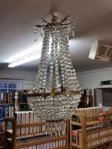 A large brass and faceted glass chandelier, 80cm high.