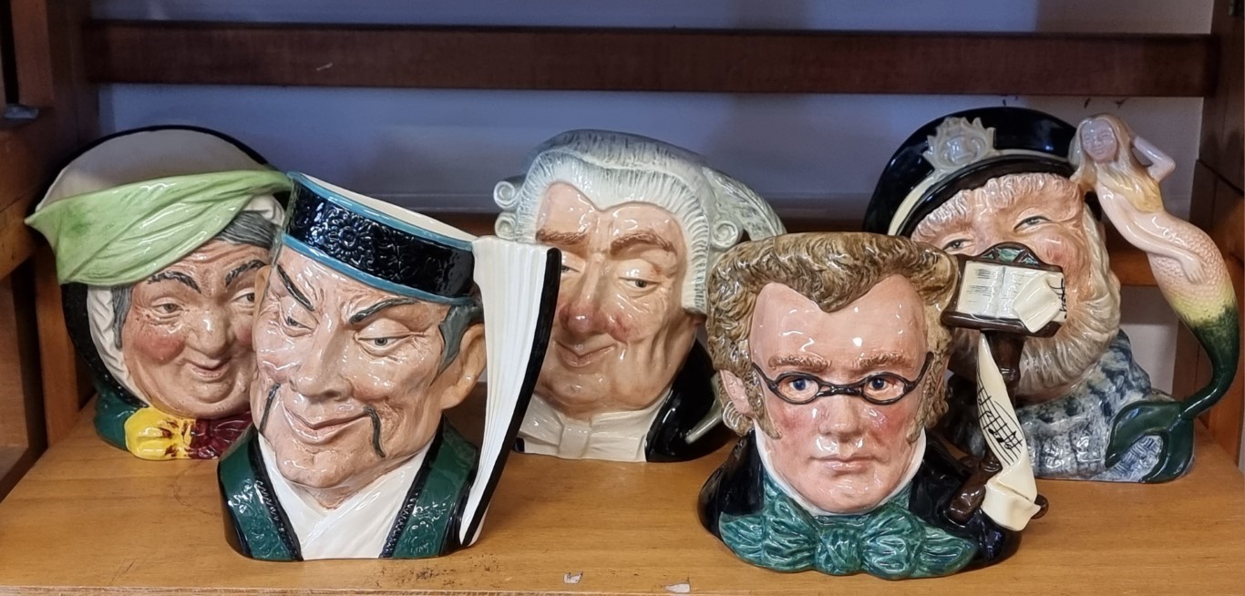 Five Royal Doulton character jugs.