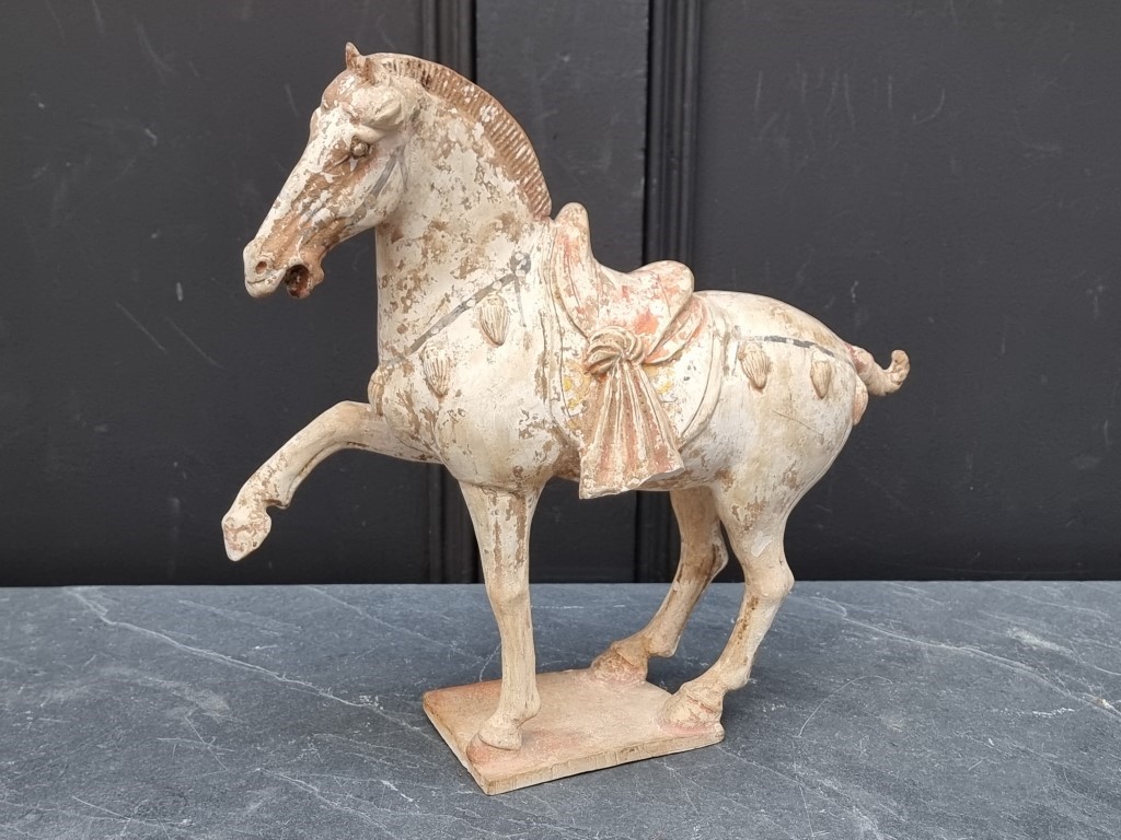 A Chinese Tang style pottery horse, 32cm high, (s.d.).