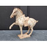 A Chinese Tang style pottery horse, 32cm high, (s.d.).