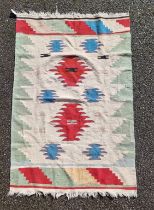 A Tribal flatweave rug, 177 x 115cm.