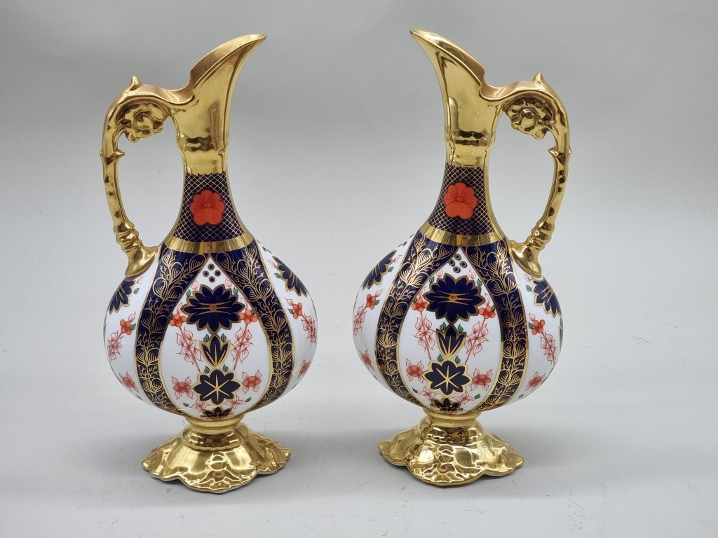 A pair of Royal Crown Derby Imari ewers, 26cm high.