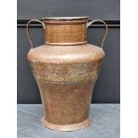 A large copper twin handled vessel, 41cm high.