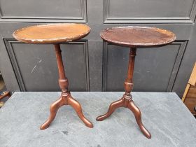 Two similar small mahogany reproduction tripod tables, largest 51.5cm high.