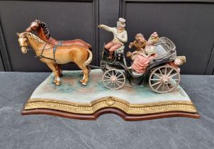 A large Capodimonte figure group of a horse drawn carriage, 64cm wide, (chips).