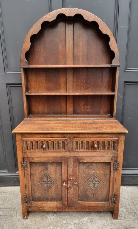 A small reproduction oak dresser and dome top rack, 91.5cm wide.