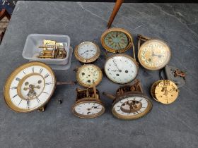 A mixed group of clocks and timepiece dials and movements, to include a Smiths car clock.