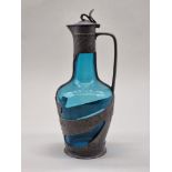 A Continental Art Nouveau pewter and blue glass claret jug, 29cm high.