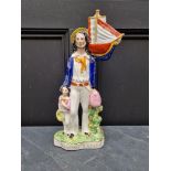 A large Victorian Staffordshire pottery figure of 'Begging Sailor', 43cm high.