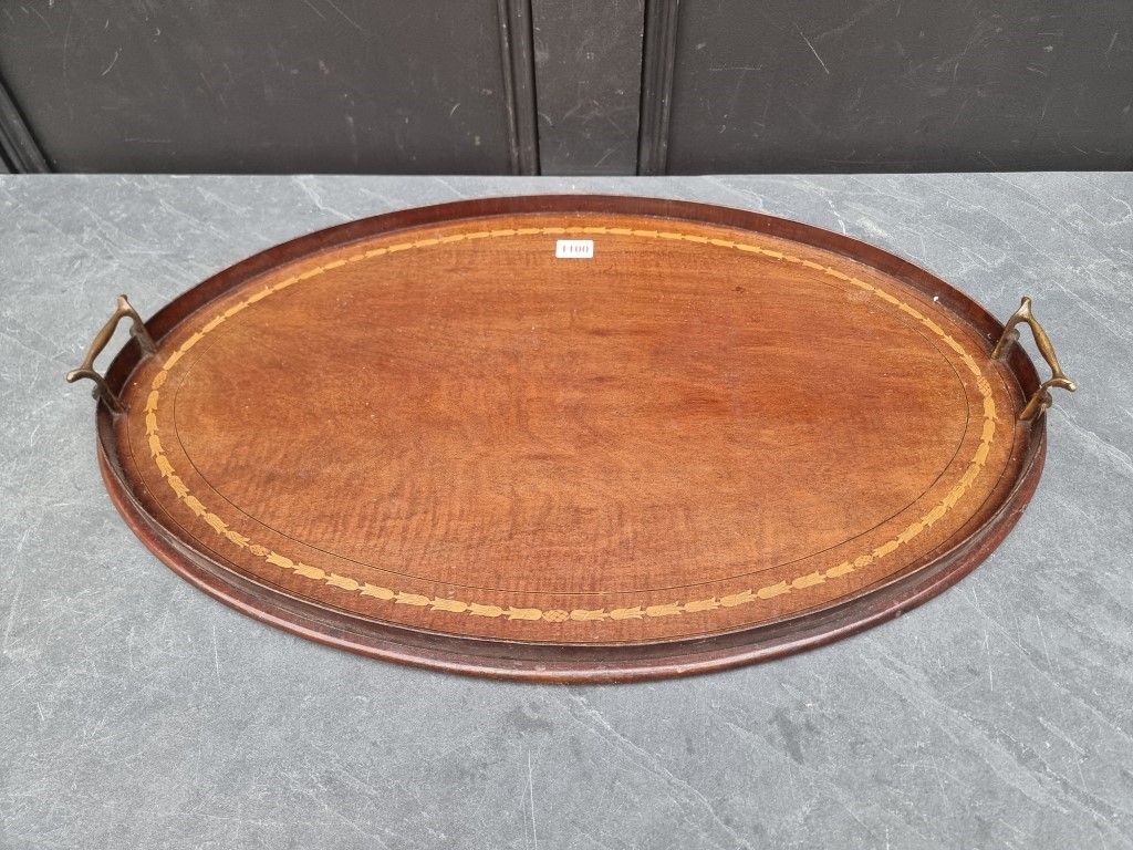 An Edwardian mahogany and inlaid twin handled oval gallery tray, 68cm wide.