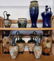 A collection of Royal Doulton stoneware vases, ewers and similar, largest 29.5cm high, (s.d.). (10)