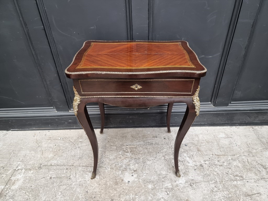 A Louis XV style, mahogany and brass occasional table, the hinged top with mirrored panel, 58cm
