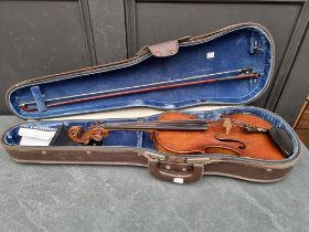 An antique Continental violin, with 14in one piece back, with bow and case.