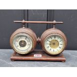 A late Victorian walnut combined clock and barometer set, with ivorine dials, 23.5cm wide.