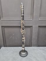 A clarinet, on stand.