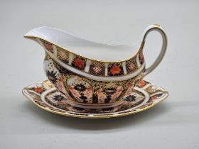 A Royal Crown Derby Imari sauce boat and stand.