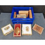 Twelve vintage cigar boxes, no contents.