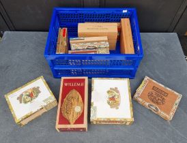Twelve vintage cigar boxes, no contents.