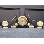 An Art Deco slate and green onyx clock garniture, the clock 52.5cm wide.