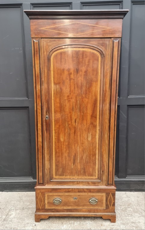 A late Victorian mahogany crossbanded and line inlaid single wardrobe, 91cm wide.