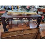 A reproduction Chinese hardwood low occasional table, 80cm wide.