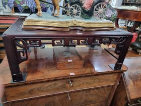 A reproduction Chinese hardwood low occasional table, 80cm wide.