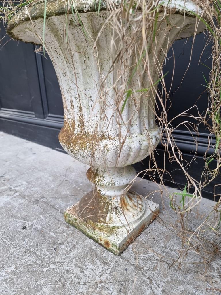 A pair of Victorian white painted cast iron urns, 48.5cm high. (2) - Image 4 of 4