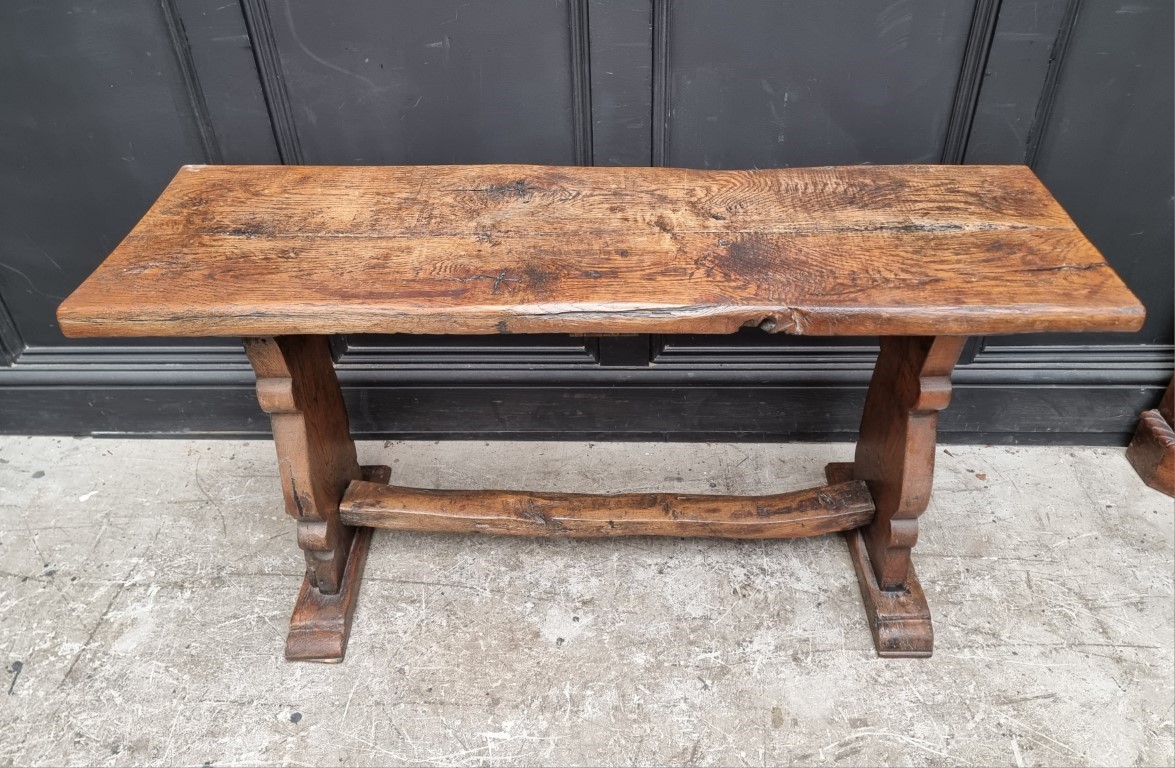 A rustic oak table bench, 125cm wide.