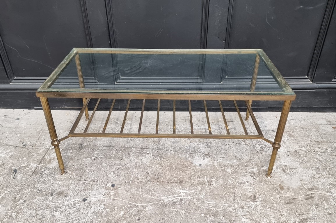 A vintage brass and glass topped rectangular low occasional table, 92cm wide.
