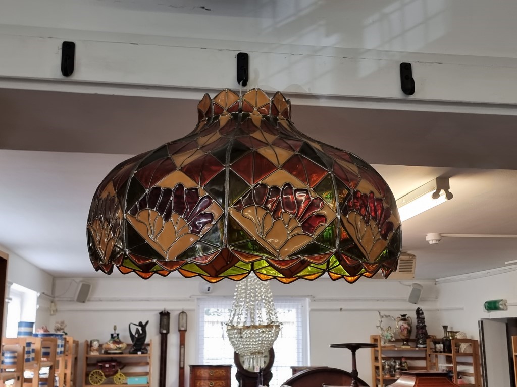 A large Tiffany style lamp shade, 64.5cm wide.