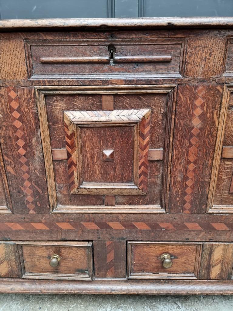 A late 17th century panelled oak and parquetry mule chest, 129.5cm wide. - Image 3 of 11