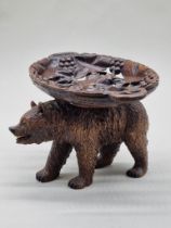 A Black Forest carved wood bear comport, 28cm wide, (probably associated).
