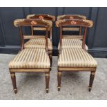 A set of four George IV faux grained and parcel gilt bar back dining chairs. (4)