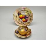 A Royal Worcester fruit painted cabinet cup and saucer, painted by Ricketts, the saucer 17cm