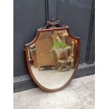 A 1920s mahogany shield shaped wall mirror, 94 x 69cm.