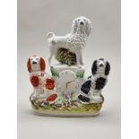 A Victorian Staffordshire pottery dog and clock figure group, 24.5cm high.