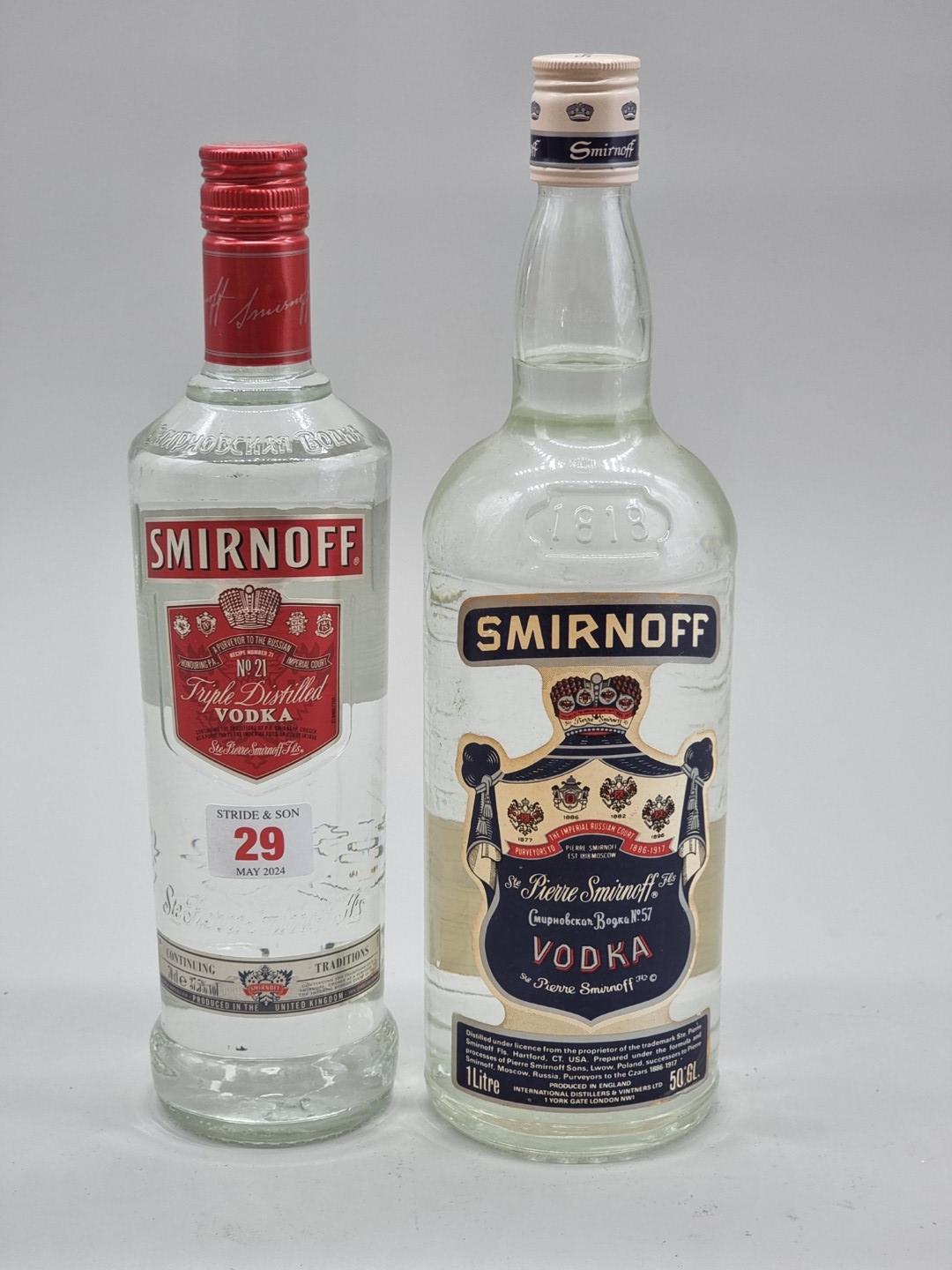 A 1 litre bottle of Smirnoff Vodka, 50% abv, probably 1980s bottling; together with another later