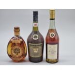 A 1 litre bottle of Martell VS Cognac; together with a 70cl bottle of VSOP Armagnac; and a 70cl