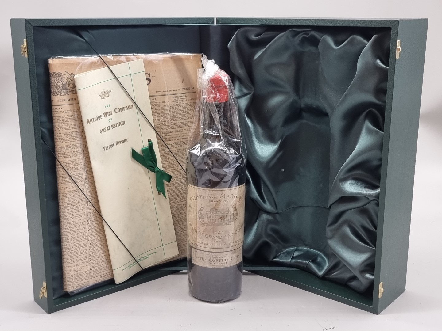 A bottle of Chateau Margaux, 1944, in presentation box, with certification and The Times,