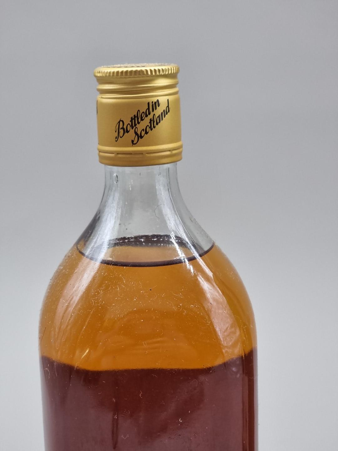 Two old 1 litre bottles of blended Whisky, probably 1970s bottlings, comprising: The Real - Image 5 of 7