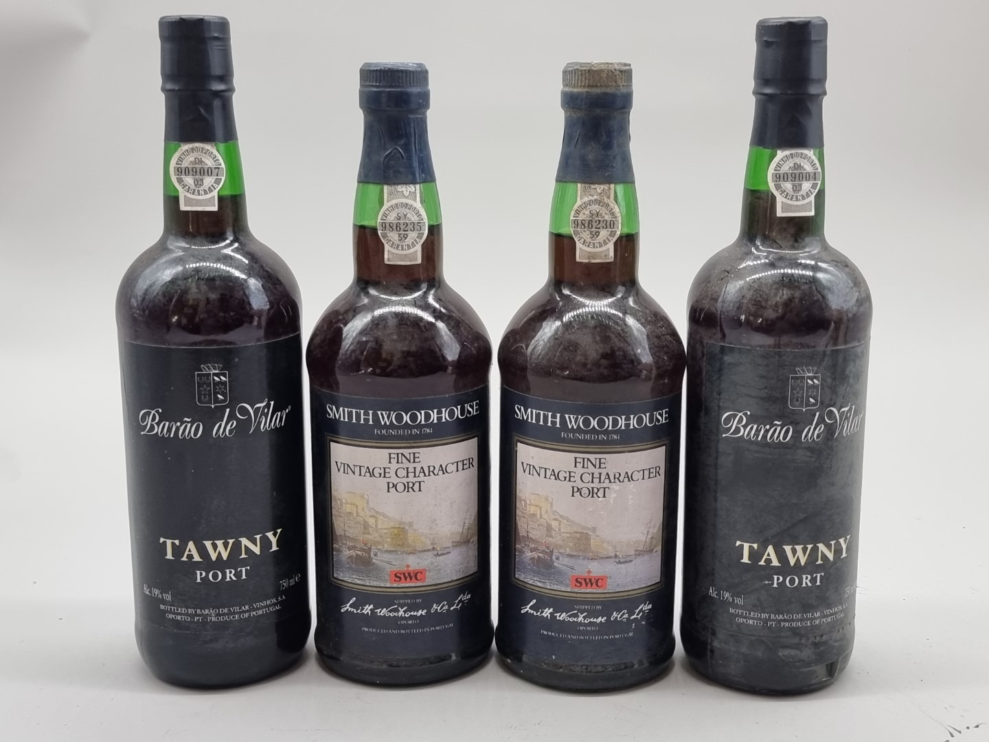 Four bottles of Port, comprising: two Barao de Vilar Tawny; and two Smith Woodhouse Fine Vintage