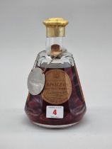 An old bottle of Courvoisier Napoleon Fine Champagne Cognac, 1960s bottling, in Baccarat crystal