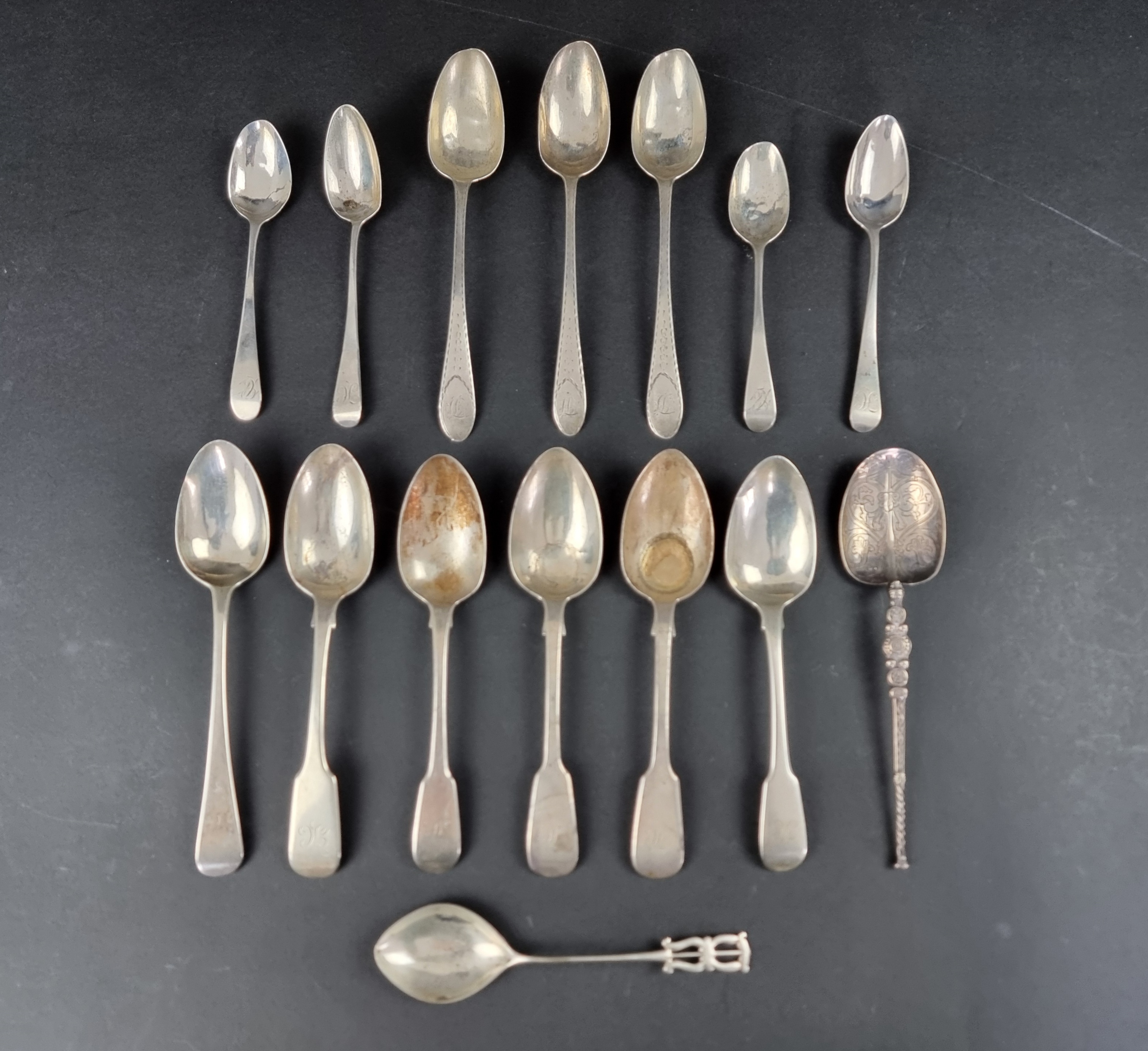 A small quantity of Georgian and later unmatched silver cutlery, 305g; together with four other