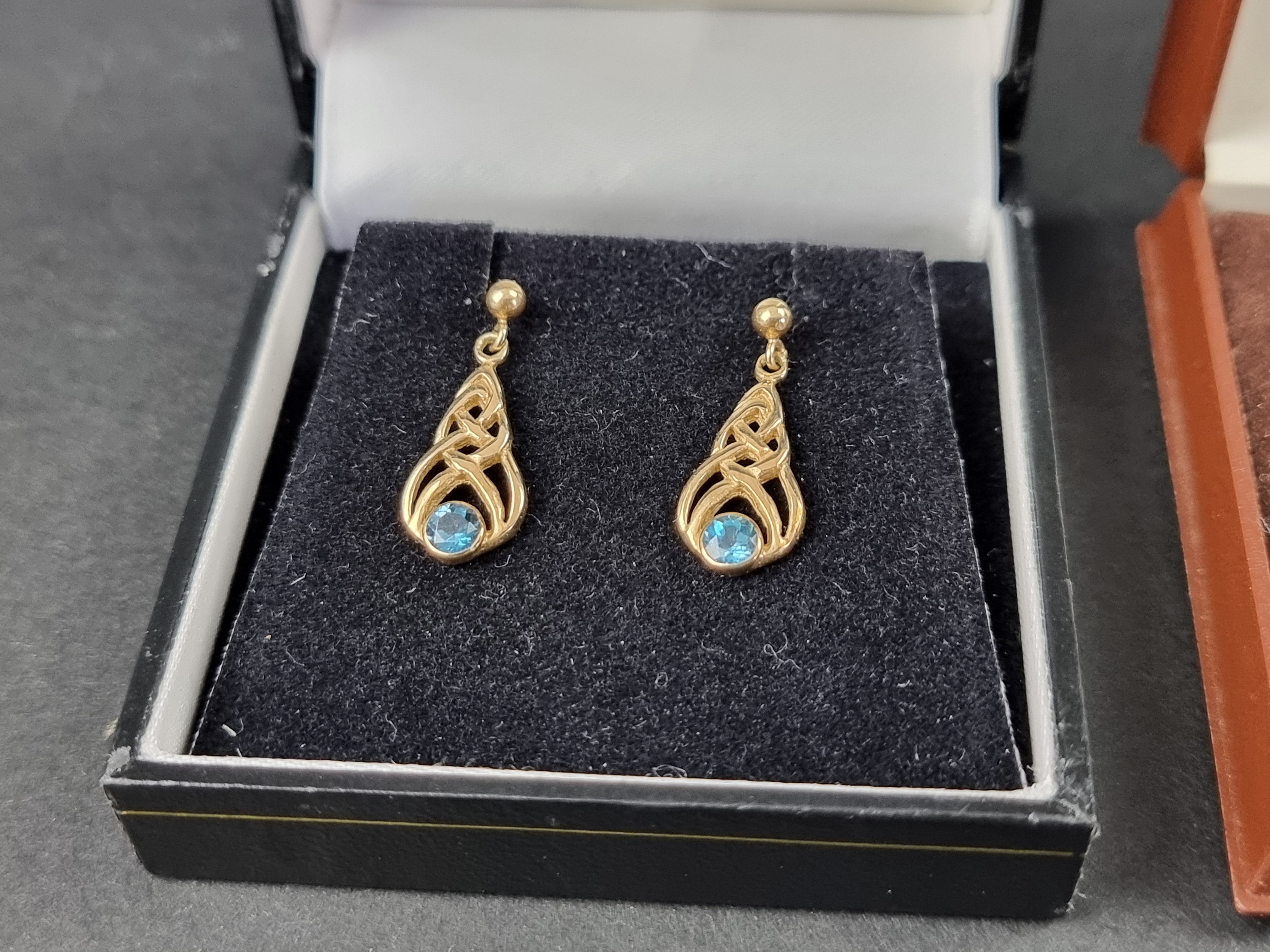 A pair of 9ct gold blue topaz earrings; together with another pair of 9ct gold blue gem set - Image 4 of 5