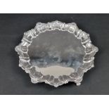 An Edwardian silver piecrust card tray, by Atkin Brothers, Sheffield 1906, 22cm diameter, 305g.