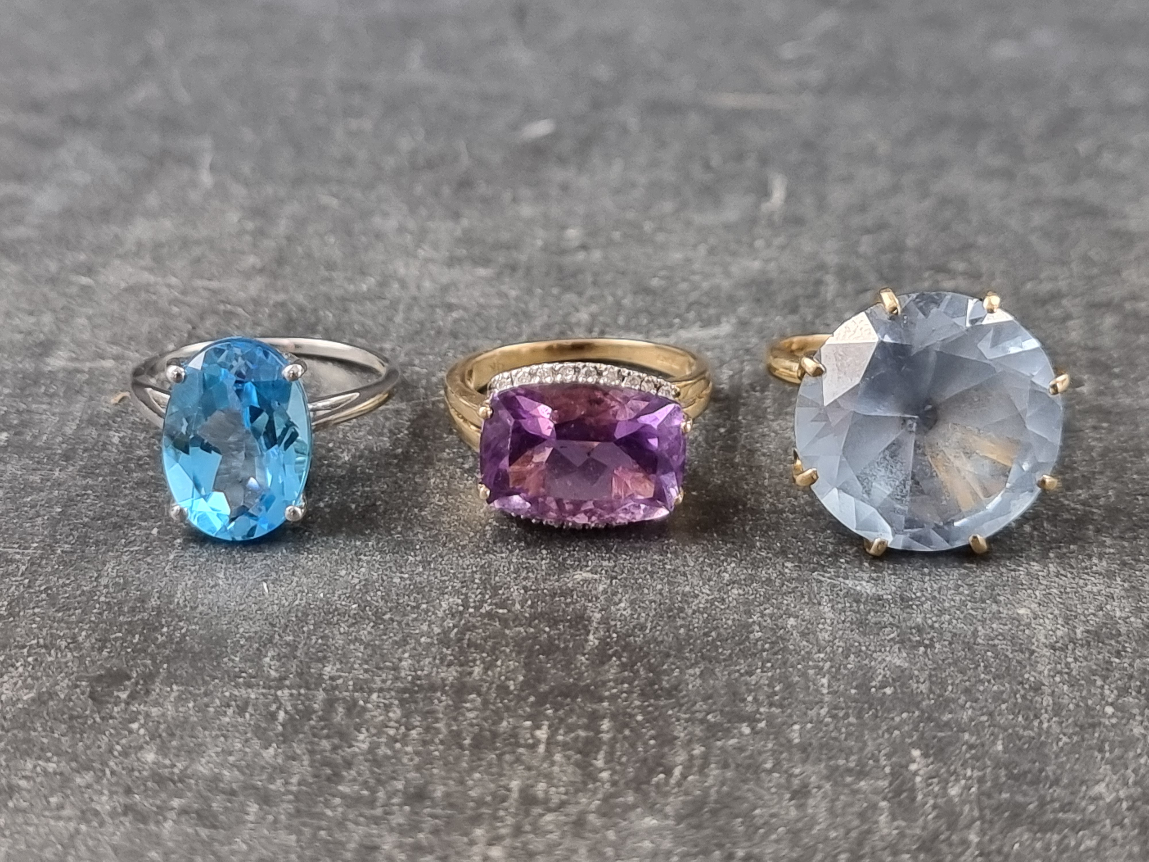 A 9ct gold amethyst and diamond cocktail ring, size M; together with two other 9ct gold gem set