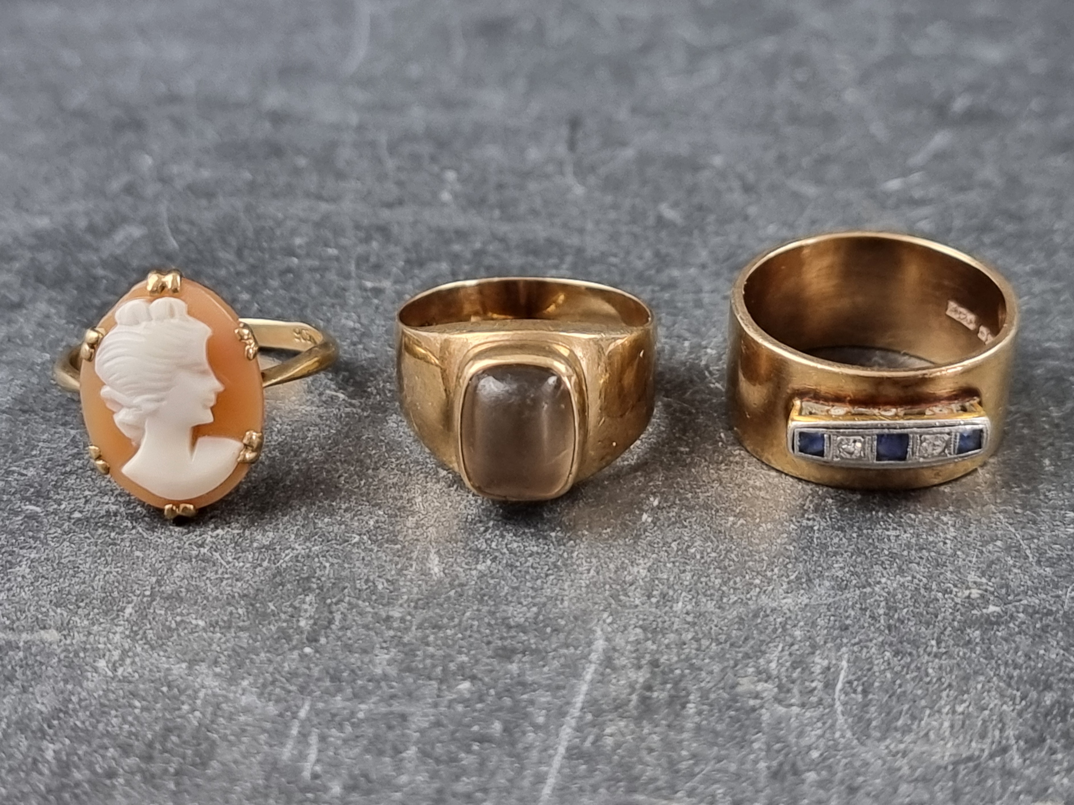 Two gem set 9ct gold rings, gross weight 10g; together with a carved shell cameo ring, stamped '
